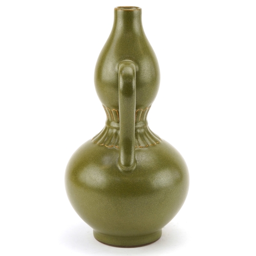 193 - A Chinese porcelain teadust glazed double gourd vase with twin handles, six figure character marks t... 