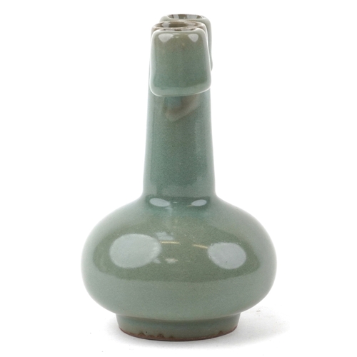 1571 - A Chinese porcelain celadon glaze bottleneck vase with ears, 14cm high.