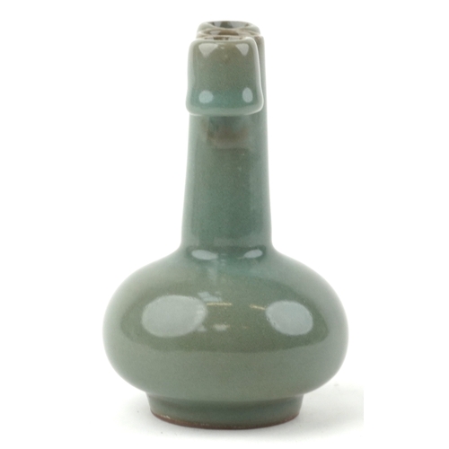 1571 - A Chinese porcelain celadon glaze bottleneck vase with ears, 14cm high.