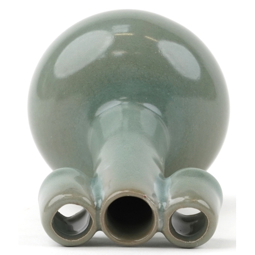 1571 - A Chinese porcelain celadon glaze bottleneck vase with ears, 14cm high.