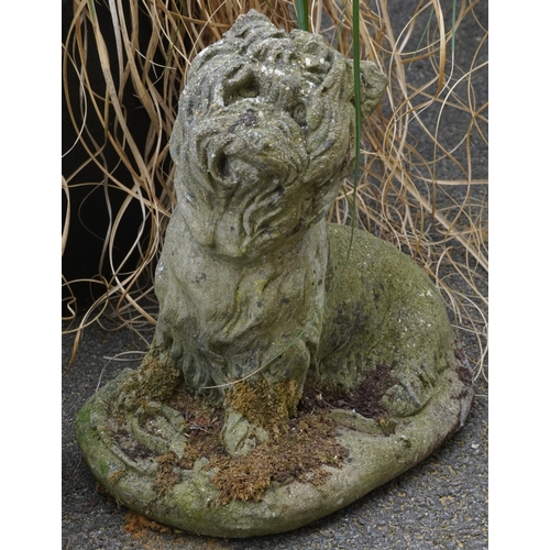 2229B - Two cast composition models of dogs, the largest 34cm high.