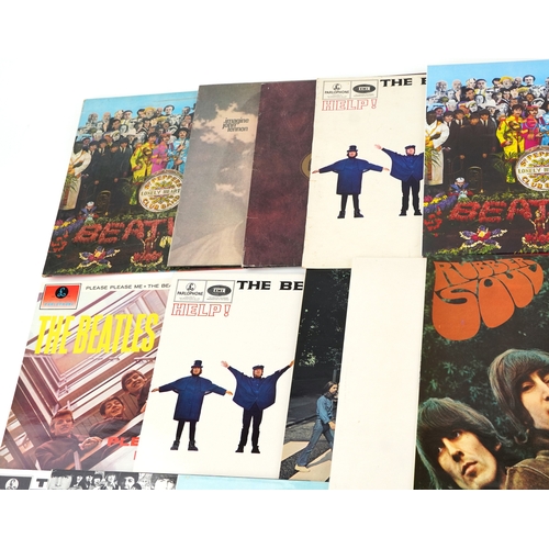2615 - A small collection of vinyl LP records by The Beatles including Help, Sgt. Pepper's Lonely Hearts Cl... 