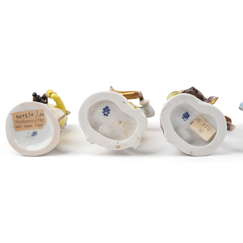 26 - A 20th century eleven piece German porcelain monkey band, after Meissen, comprising Älteste Volksted... 