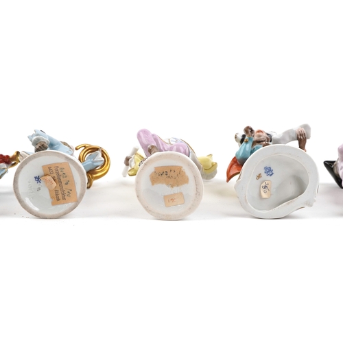 26 - A 20th century eleven piece German porcelain monkey band, after Meissen, comprising Älteste Volksted... 