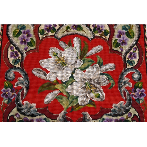 1020 - A pair of mid 20th century embroidery and beadwork pole screen panels with floral decoration, 49cm x... 