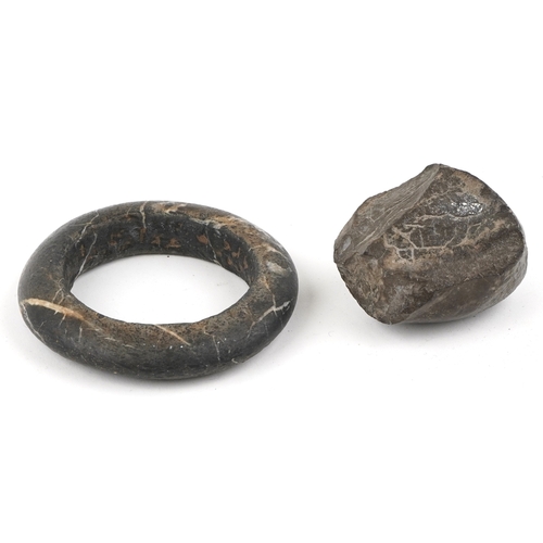 1684 - A carved stone bangle, possibly African Dogon tribe, 10cm in diameter together with a stone fragment... 