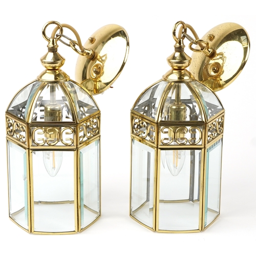 319 - A pair of gilt brass hanging lantern light fittings with bevelled glass panels, 45cm high.