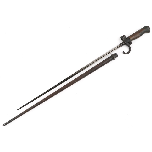 2851 - A French military interest bayonet and scabbard with cross blade, the handle and scabbard numbered 8... 