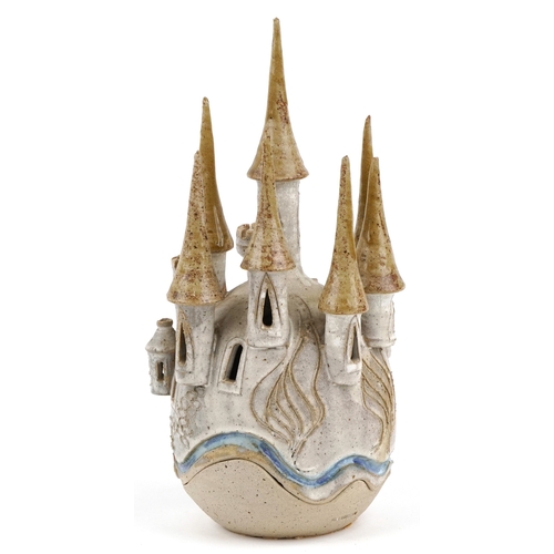 476 - A novelty studio pottery candleholder in the form of a castle, impressed Sue Pritchard to the revers... 