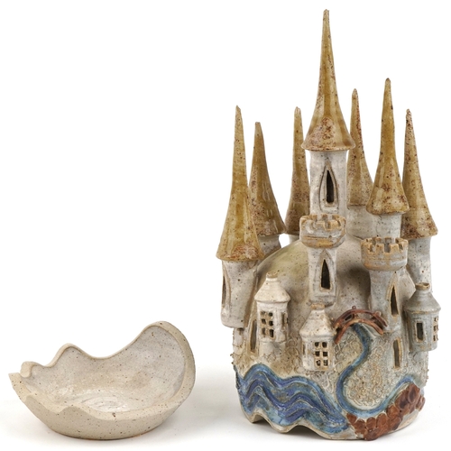 476 - A novelty studio pottery candleholder in the form of a castle, impressed Sue Pritchard to the revers... 