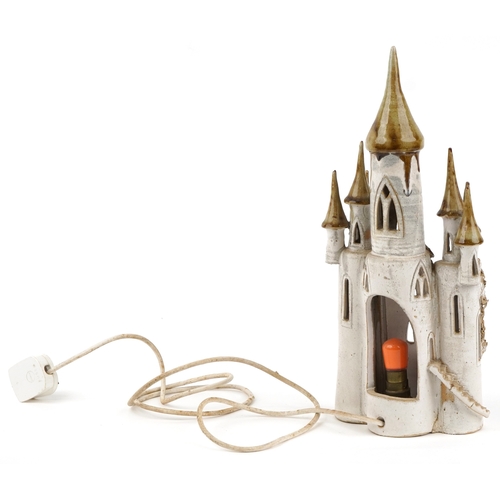 475 - A studio pottery novelty table lamp base in the form of a castle, possibly by Sue Pritchard, 41cm hi... 