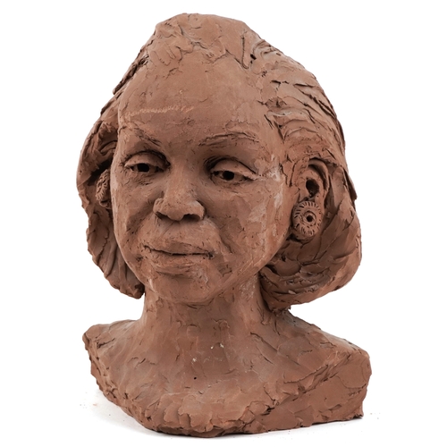 115 - A 20th century plaster head and shoulders portrait bust of a woman, 33cm high.