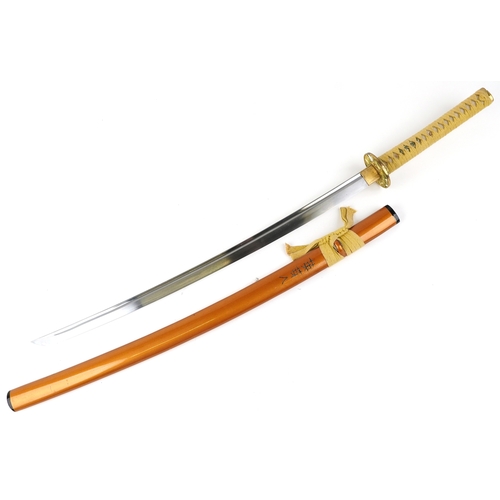 2856 - A decorative Japanese Katana sword with a string bound shagreen grip, the sheath signed, overall 103... 