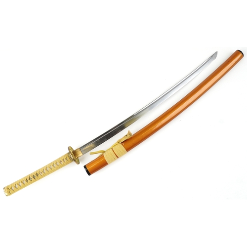 2856 - A decorative Japanese Katana sword with a string bound shagreen grip, the sheath signed, overall 103... 