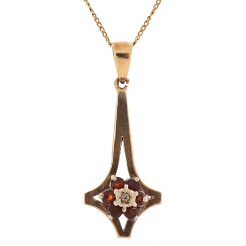 3304 - A 9ct gold garnet and diamond cluster pendant on a 9ct gold necklace, 2.6cm high and 48cm in length,... 