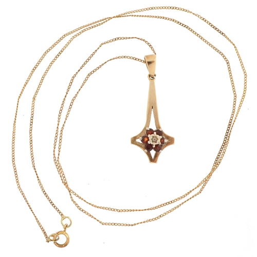 3304 - A 9ct gold garnet and diamond cluster pendant on a 9ct gold necklace, 2.6cm high and 48cm in length,... 