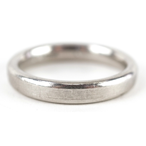 3372 - A platinum and baguette cut diamond ring, size U, 12.0g.