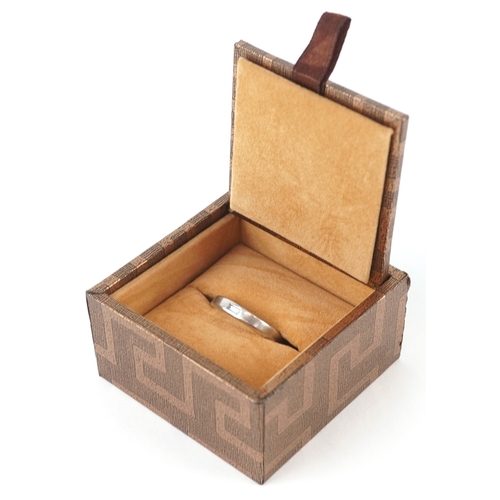 3372 - A platinum and baguette cut diamond ring, size U, 12.0g.