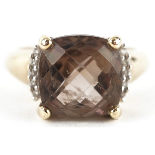 3272 - A 9ct gold smoky quartz ring with diamond set shoulders, size K/L, 3.5g.