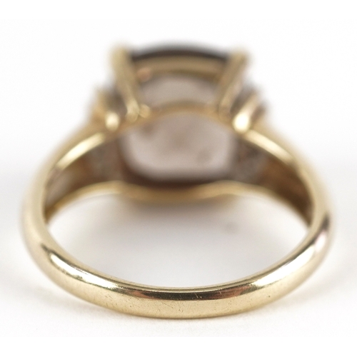 3272 - A 9ct gold smoky quartz ring with diamond set shoulders, size K/L, 3.5g.