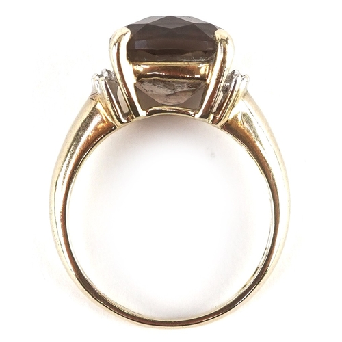 3272 - A 9ct gold smoky quartz ring with diamond set shoulders, size K/L, 3.5g.