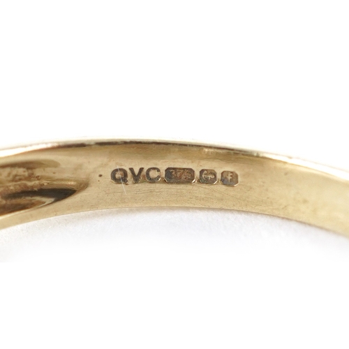 3272 - A 9ct gold smoky quartz ring with diamond set shoulders, size K/L, 3.5g.