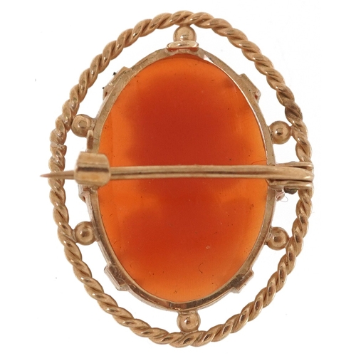 3193 - A 9ct gold mounted cameo shell brooch carved with a maiden, 2.6cm high, 3.6g.