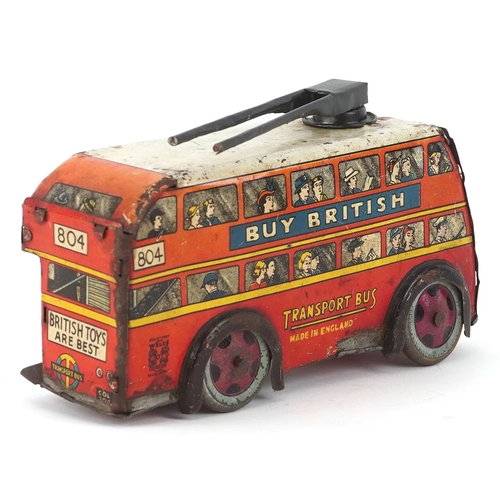 730 - A mid 20th century Wells Brimtoy tinplate clockwork trolleybus, 17cm wide.