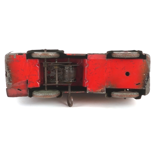 730 - A mid 20th century Wells Brimtoy tinplate clockwork trolleybus, 17cm wide.