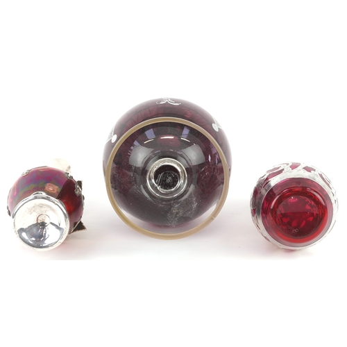 3738 - Three similar 20th century silver mounted cranberry glass vases with engraved decoration, the larges... 