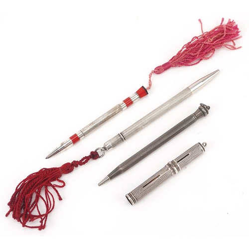 67 - Four antique silver cased propelling pencils including a William Vale & Sons engine turned example, ... 