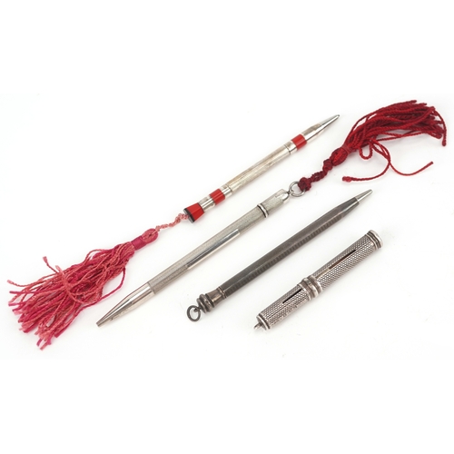 67 - Four antique silver cased propelling pencils including a William Vale & Sons engine turned example, ... 