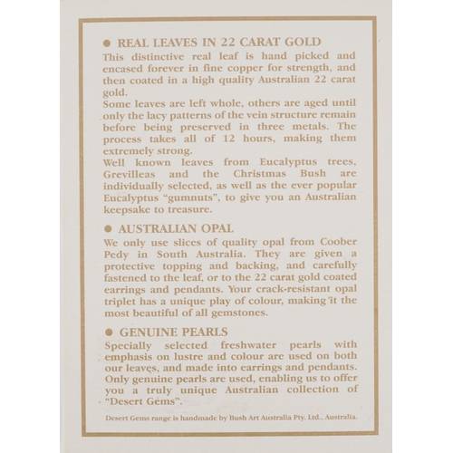 3469 - A Desert Gems gold plated and cultured pearl eucalyptus brooch, 7cm wide, 5.6g.