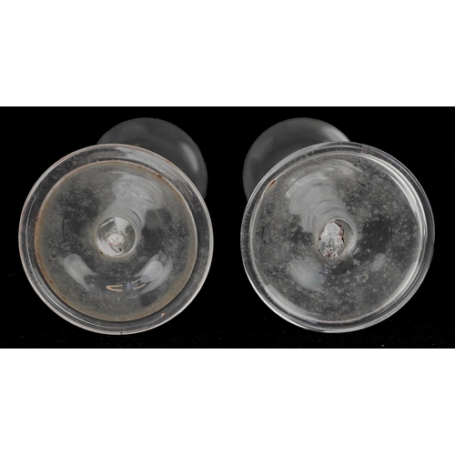 43 - A near pair of 18th century air twist stem glasses, each 14.5cm high.