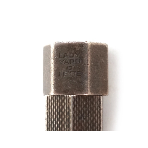 68 - A Yard-O-Led Lady Yard-O-Lette engine turned silver propelling pencil together with a white metal ex... 