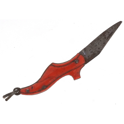 310 - A 19th century miniature folding pocket knife in the form of a shoe, 3.5cm in length.