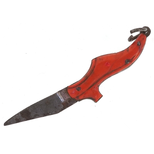 310 - A 19th century miniature folding pocket knife in the form of a shoe, 3.5cm in length.