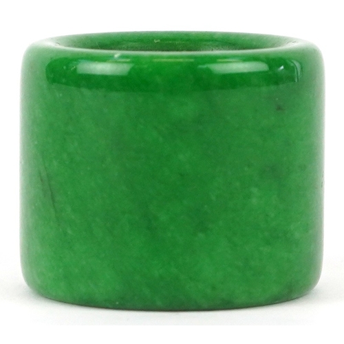 1828 - A Chinese green stone archer's ring, size Z+, 44.4g.
