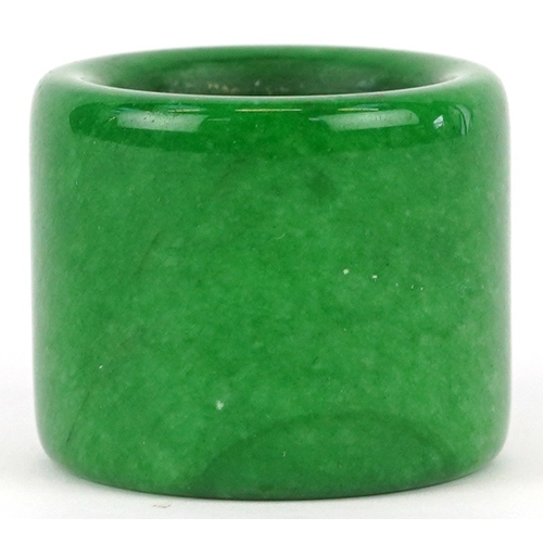 1828 - A Chinese green stone archer's ring, size Z+, 44.4g.