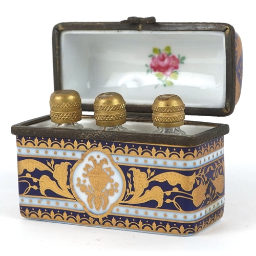 1677 - A hand painted Limoges style porcelain trinket housing three miniature glass scent bottles, 6cm wide... 