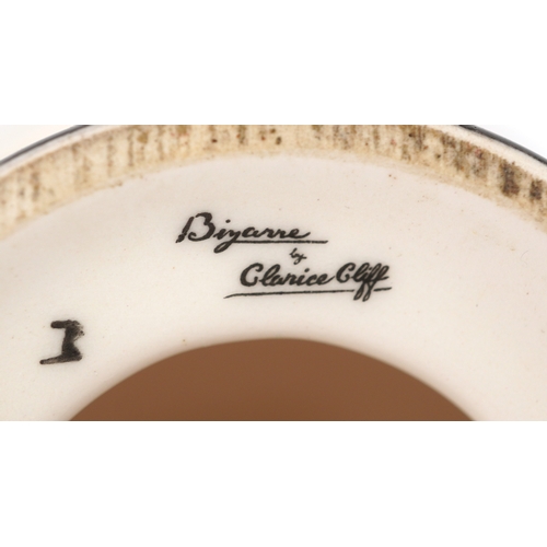 622 - Clarice Cliff by Wedgwood, a hand painted pottery study of flowers in a vase, 18cm high.