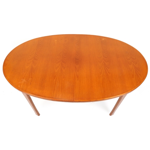 2097 - A mid 20th century teak oval extending dining table, 74cm H x 162cm W x 100cm D together with a matc... 