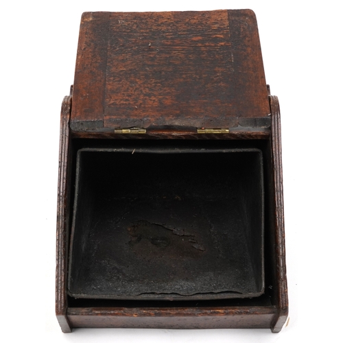 2158 - A late Victorian aesthetic movement oak coal scuttle with applied brass hinges and carrying handle, ... 