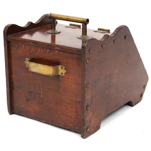 2158 - A late Victorian aesthetic movement oak coal scuttle with applied brass hinges and carrying handle, ... 