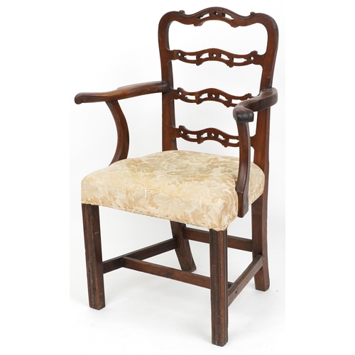 2160 - A 19th century mahogany pierced ladder back elbow chair, the overstuffed seat raised on moulded bloc... 
