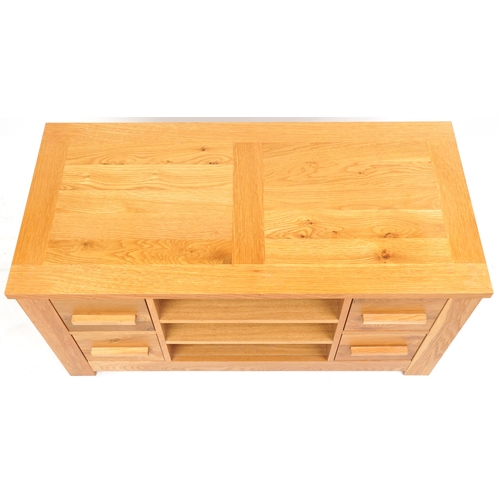 2035 - A modern oak side cabinet fitted with drawers and open shelves, 57cm H x 115cm W x 55cm D.