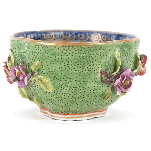 90 - A Chinese porcelain four lobed tea bowl moulded in relief with flower sprays, 19th century, 4.5cm hi... 