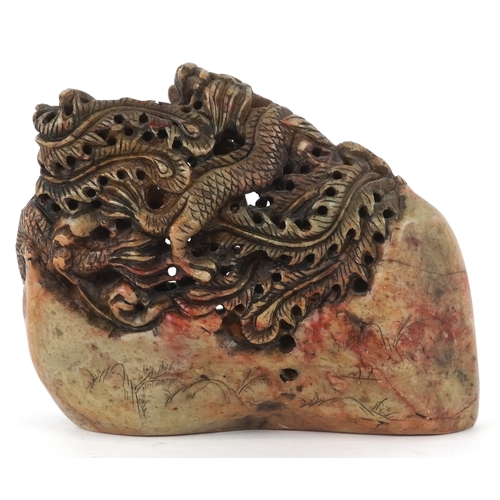 454 - A Chinese soapstone carving of dragons and mythical creatures, character marks to the base, 13.5cm h... 