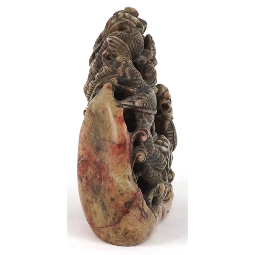 454 - A Chinese soapstone carving of dragons and mythical creatures, character marks to the base, 13.5cm h... 