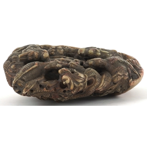 454 - A Chinese soapstone carving of dragons and mythical creatures, character marks to the base, 13.5cm h... 
